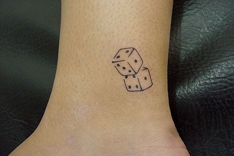 dés tatouage signification