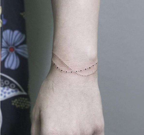 Conception et idées de tatouages ​​de bracelet à pois