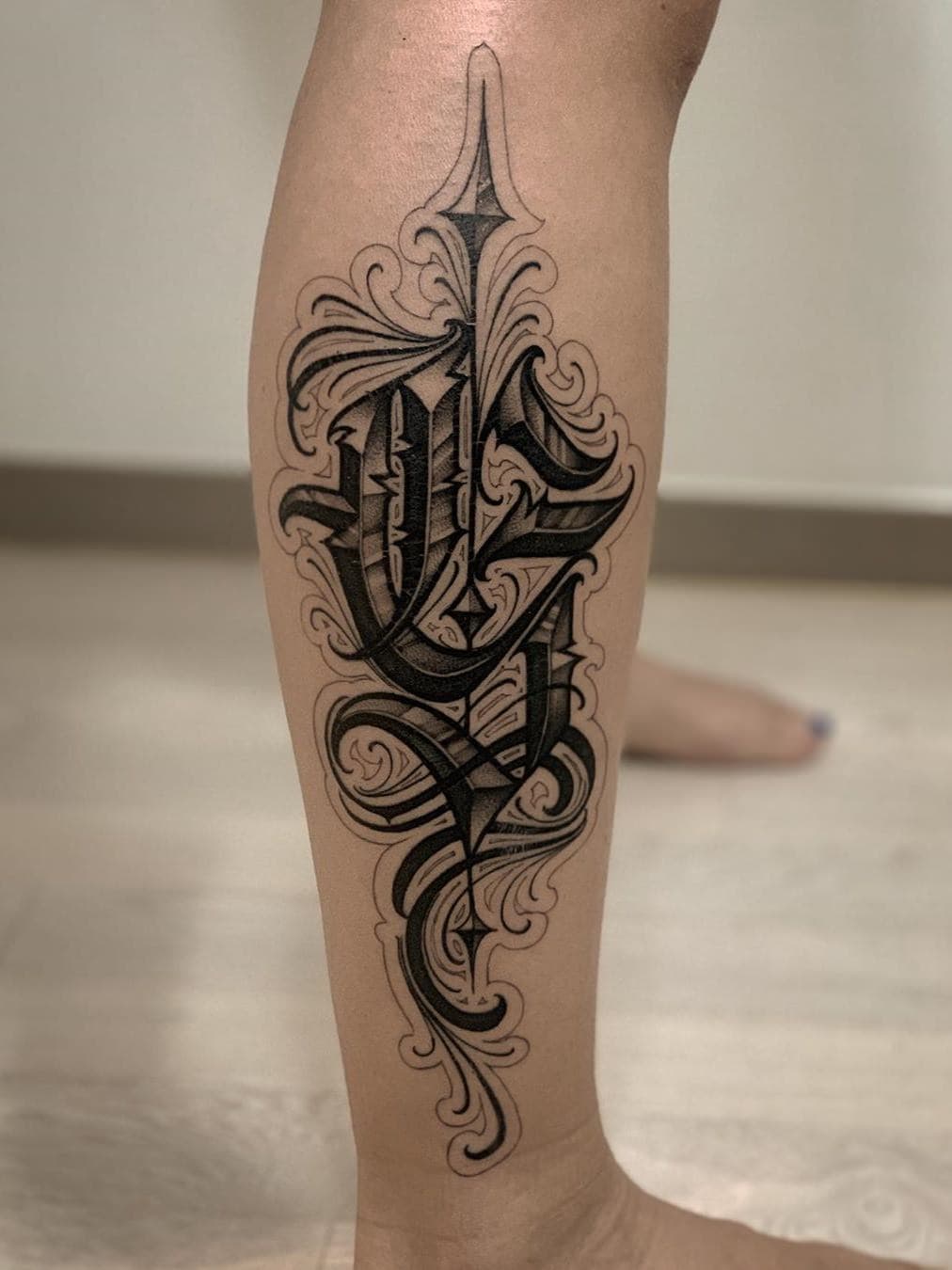 Letter Calf Tattoo